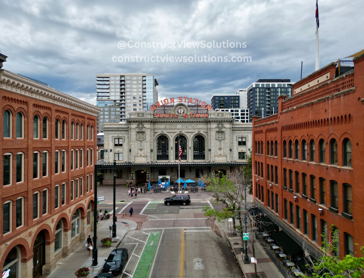 Aerial streetscape view of a historic downtown transportation building and surrounding architecture
