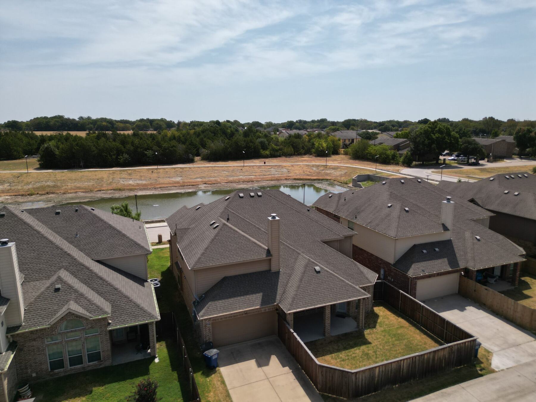 Elevated aerial view showing neighborhood and property context