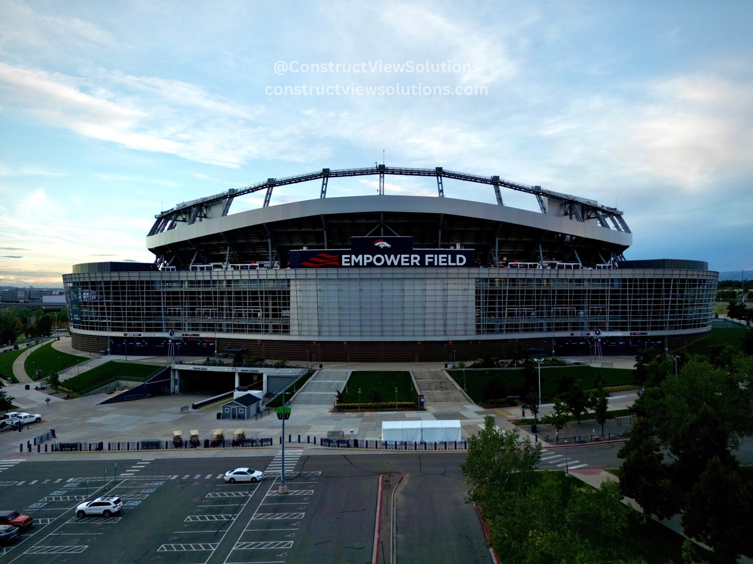 Aerial exterior view of a large stadium and surrounding access areas